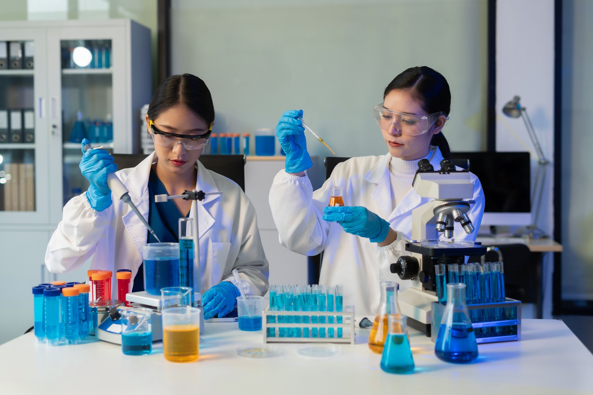 Glass vial, pipette and scientist in laboratory for medical study, research or experiment. Test tube, dropper and professional person with chemical liquid for pharmaceutical innovation.